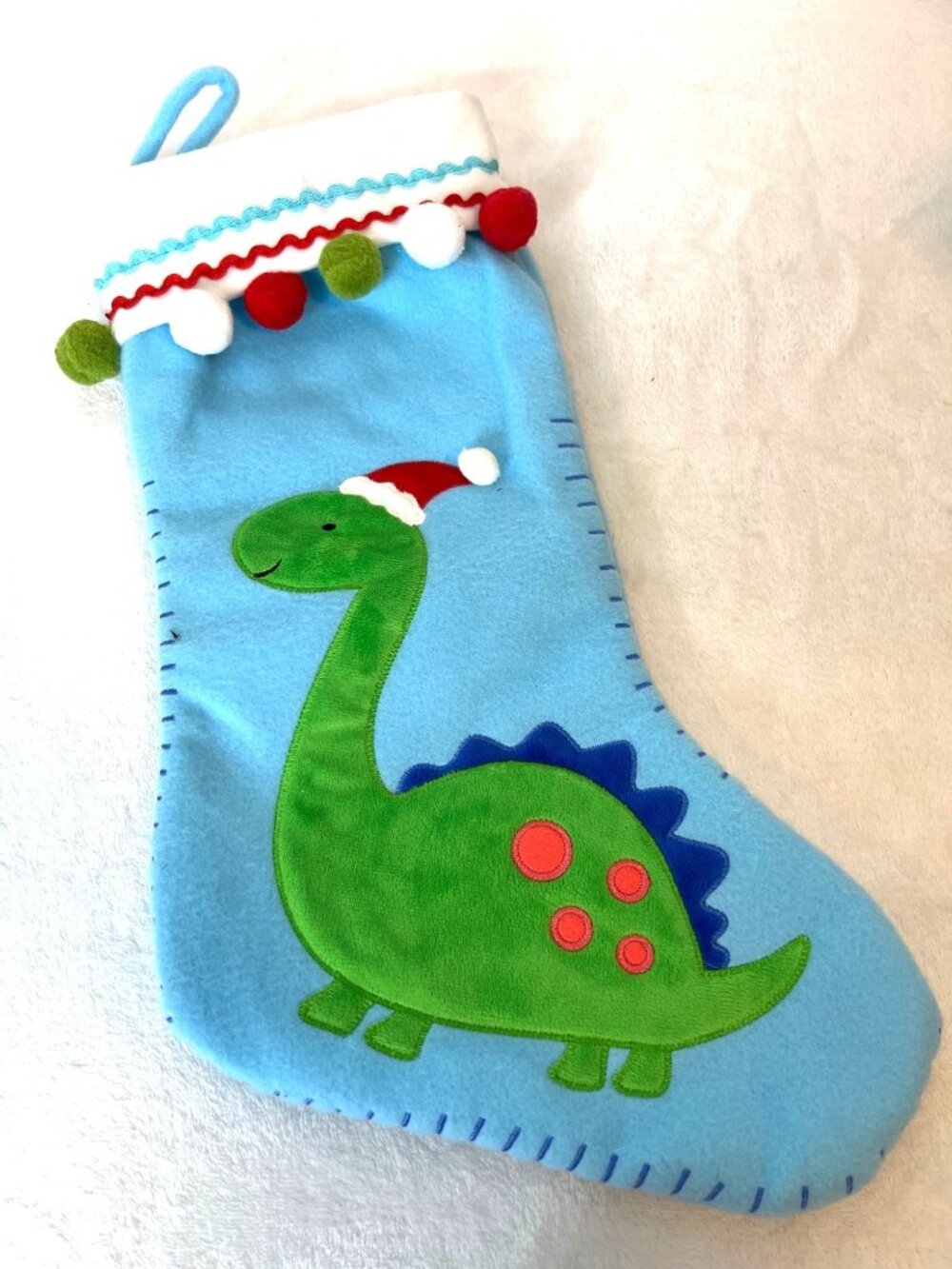 Dinosaur Christmas Stocking Santa brontosaurus. Tassels Holiday Sock